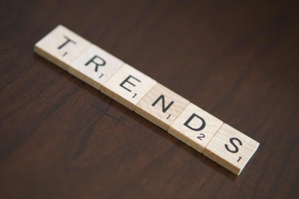 A diagonal row of Scrabble tiles spelling out "trends"